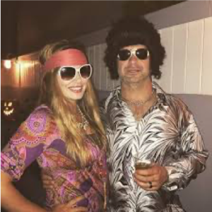 couple wearing 70's clothing for halloween