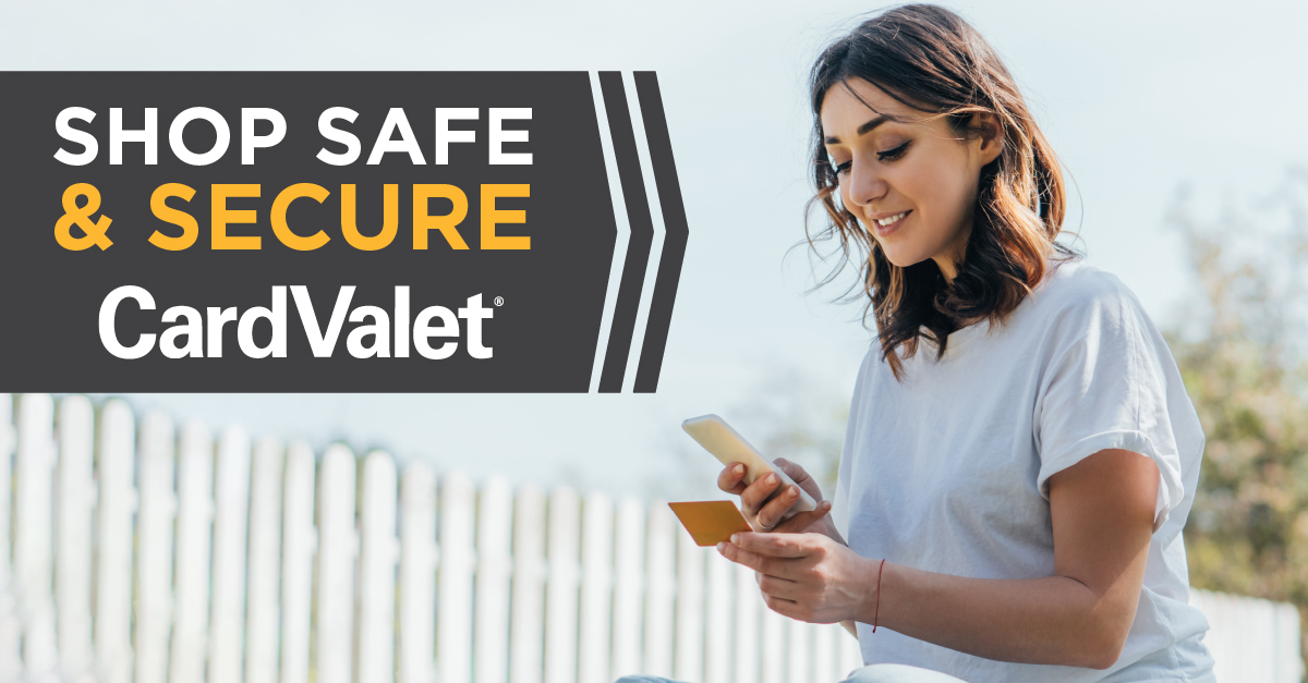 Woman checking her phone and looking at a credit card with the text "Shop Safe and Secure CARDVALET"