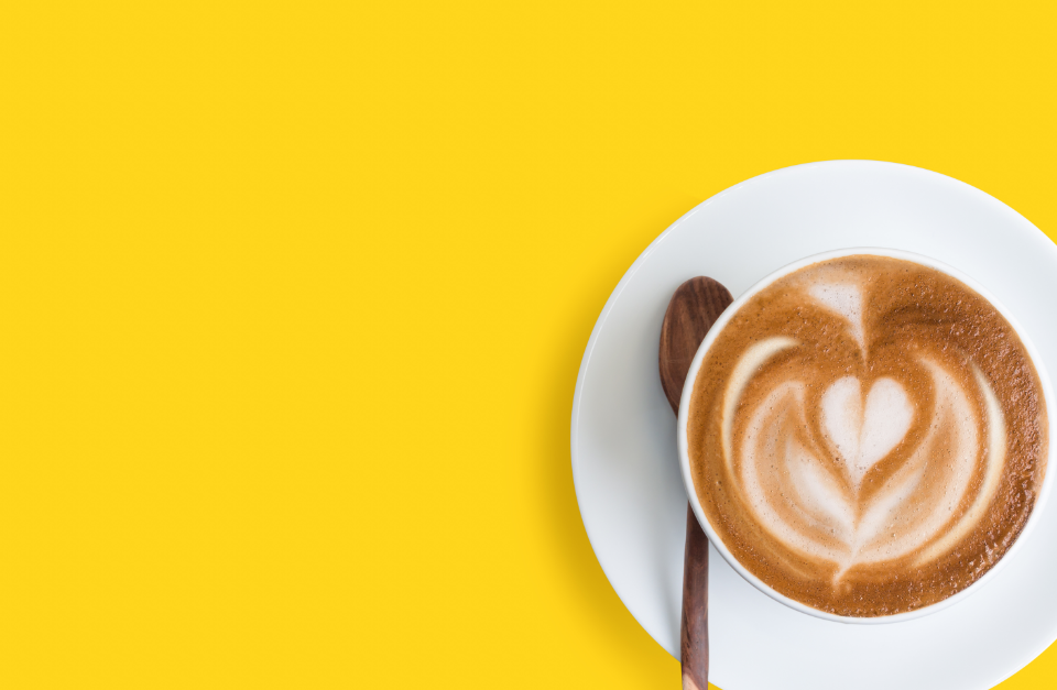 latte on a yellow backdrop