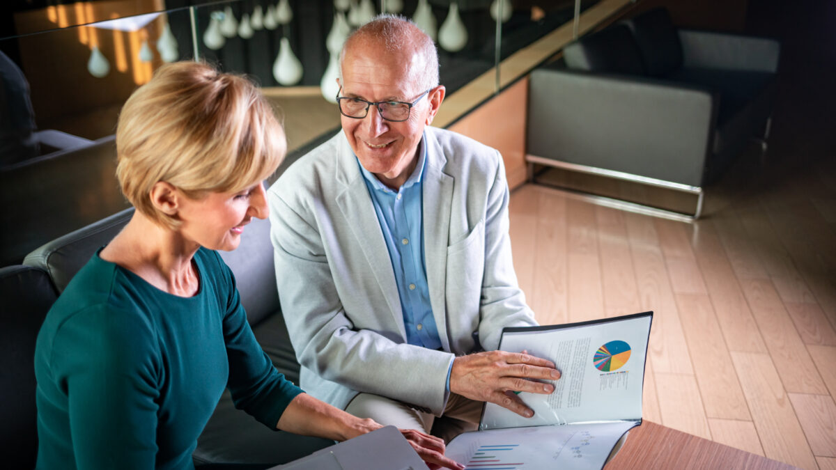 Businessman And Businesswoman Meeting In Modern Office