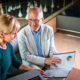 Businessman And Businesswoman Meeting In Modern Office