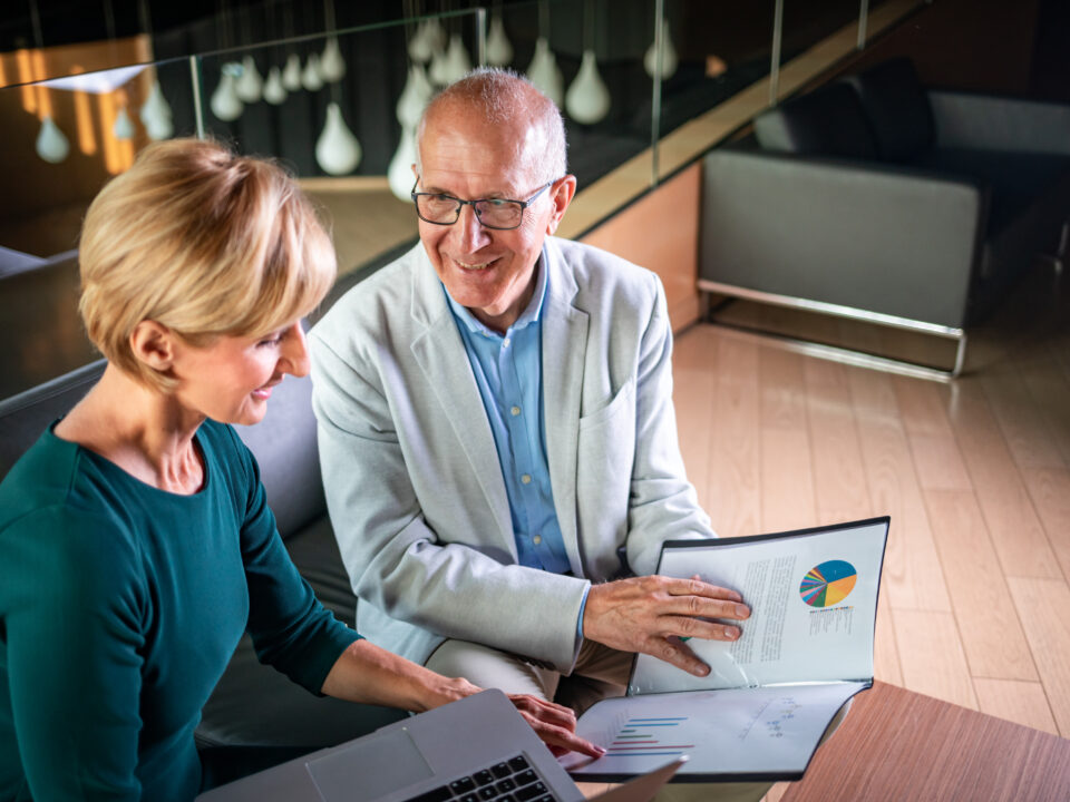 Businessman And Businesswoman Meeting In Modern Office