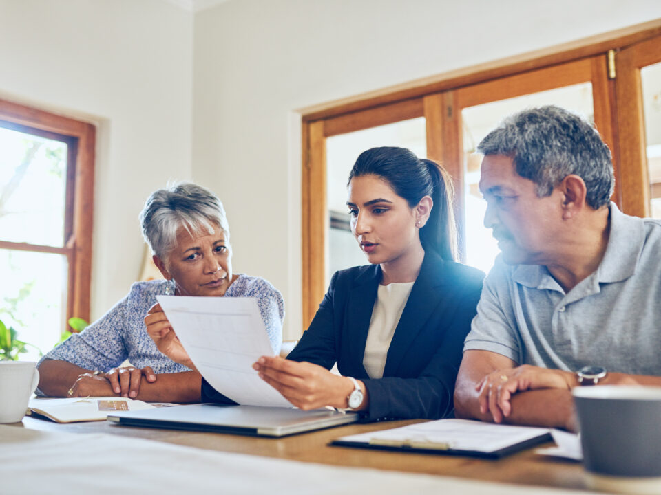 Shot of a mature couple getting advice from their financial consultant at home.