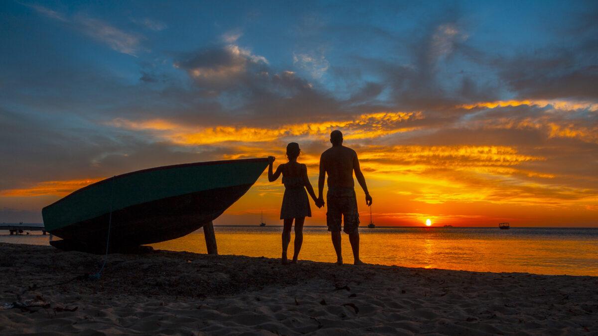 A couple in love at Roatan Sunset from West End. Honduras