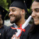 Happy diverse students graduating university, celebrating with d