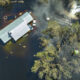 Flooded houses by hurricane Ian rainfall in Florida residential area. Consequences of natural disaster.